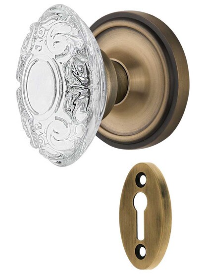 Classic Rosette Mortise-Lock Set with Victorian Crystal-Glass Knobs in Antique Brass.